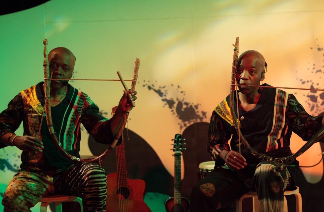 Raymond and Kouame Sereba playing dodo mouth bows