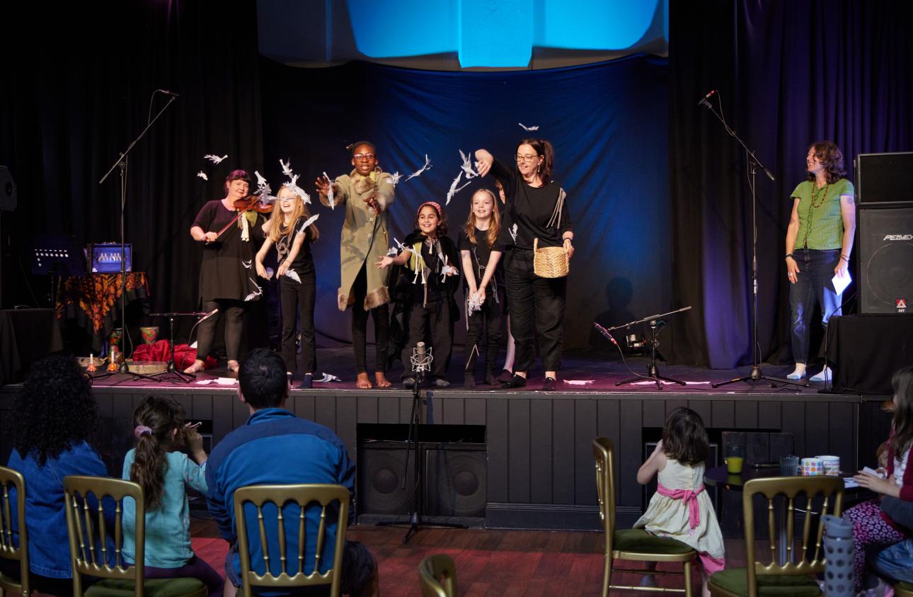 The young people from the August Make Your Story share their story with an audience of families and friends.