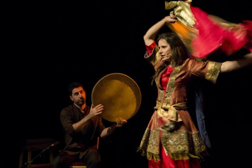 Arash Moradi plays the tanbour and Xanthe Gresham Knight swirls a red and gold scarf
