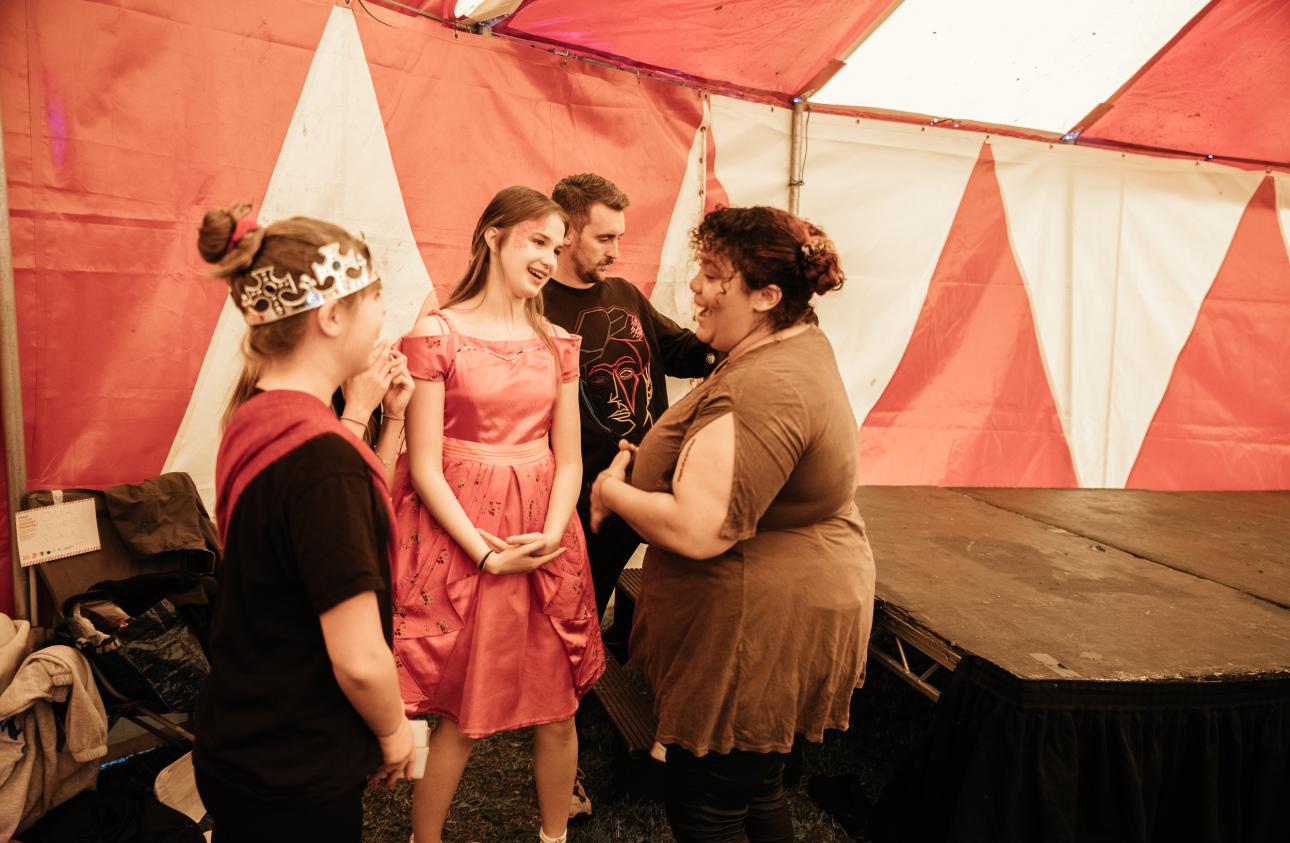 artists aoife o'connor and lewis doherty with young people just before they go on stage at tapton lock festival